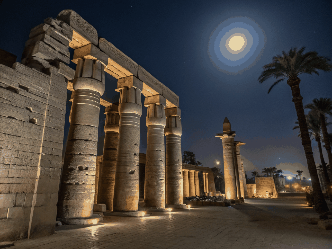 Monumental sandstone columns and reliefs at Luxor Temple during daylight